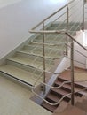 Staircase with stainless steel handrails in a modern high-rise building. The interior of modern buildings. Rise to the top of the Royalty Free Stock Photo