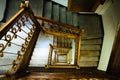 Staircase stairway. Old vintage squared spiral multi-flight stairs stairway with brown wood and metal handrails Royalty Free Stock Photo