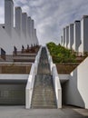 Staircase, stairway up on stepped building, terrace house with big chimney, stack