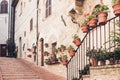 Staircase street of the old town of Assisi with ancient stone h