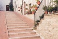Staircase street of the old town of Assisi with ancient stone h