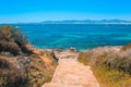 Staircase to the beach. View over beautiful coast with sailing boats in the south of Mallorca, Spain Royalty Free Stock Photo