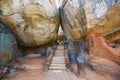 Staircase between two giant rocks at the entrance to Sigiriya rock fortress in Sigiriya, Sri Lanka.