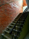 Staircase upstairs and railings at the entrance. Brick wall repair. Steps before renovation.