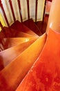 Staircase wooden spiral steps natural material close-up railing going down