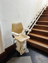A stairlift for going up and down stairs, elevator system for elderly people or with mobility problems, a mechanized chair Royalty Free Stock Photo
