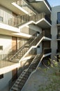 stairs apartment building, white building income wooden doors, central courtyard, mexico Royalty Free Stock Photo