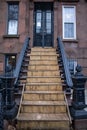 Stairs ascend towards the entrance of a building