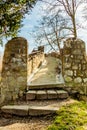 Stairs of the beginning of the path of an old stone pedestrian bridge Royalty Free Stock Photo