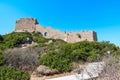 Stairs through bushes to ruins of medieval castle Kritinia Rhodes, Greece