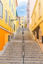 Stairs of the colorful street Travessa da Arrochela on a sunny day in summer. Travel concept. Lisbon, Portugal. Europe Royalty Free Stock Photo