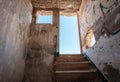 Stairs and exit of run down room in abandoned building ruin - way out