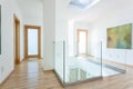 Stairs, glass banister and doors in modern hallway Royalty Free Stock Photo