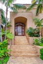Stairs and glass door with arched transom window and sidelights in San Diego CA