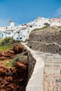 Stairs from a harbor to Oia village at Santorini island Royalty Free Stock Photo