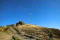 Stairs Leading to Sevanavank Monastery and a Large Group of Flying Seagulls in Blue Sky, Sevan Peninsula in Armenia Royalty Free Stock Photo