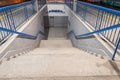 Stairs leading from the tunnel to the railway platform.