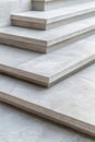 Stairs made from solid material show a series of flat steps. Each step has neat edges with plain lines and a simple design that Royalty Free Stock Photo