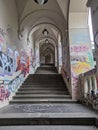 Stairs and passageways adorned with vibrant graffiti, adding an urban and artistic touch to the city\'s landscape