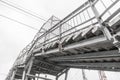 Stairs of pedestrian bridge over railway tracks. Bottom view. Technical structure for safe movement of people Royalty Free Stock Photo