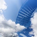 Stairs seem to lead into the clouds in blue sky