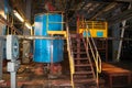 Stairs with steps and shelves with railings and equipment tanks at the industrial refinery chemical petrochemical Royalty Free Stock Photo