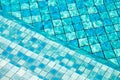 Stairs in swimming pool, Blue tile background Royalty Free Stock Photo