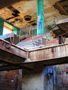 Stairs and tiled pillar in a long abandoned brewery in Germany