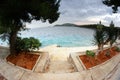 Stairs to the beach, clear water and cloudy sky in Croatia Dalmatia Royalty Free Stock Photo