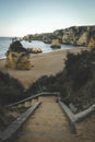 stairs to beach among stone cliffs on the shores of the atlantic ocean in Lagos Portugal