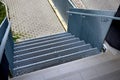 Stairs to a residential building made of stainless steel grid. galvanized stair Royalty Free Stock Photo