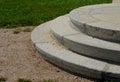 Stairs to the villa or to the church. formal staircase with three steps to the arch. Circular granite attached to a garden path ma Royalty Free Stock Photo