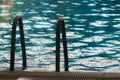 Stairs to the water of a swimmingpool Royalty Free Stock Photo