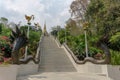 Stairs toward golden Buddhism pagoda with Thai literature animal figures along the way