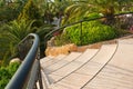 Stairs into the tropical garden with palms and other plants Royalty Free Stock Photo