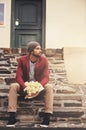 Stairs, waiting and man with bouquet for anniversary, valentines day or first date in outdoor city. Roses, flowers and Royalty Free Stock Photo