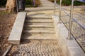 Stairs and a wastebin in the park during daytime Royalty Free Stock Photo