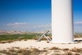 Stairs on wind mill during bright summer day. green meadow with Wind turbines generating electricity. Royalty Free Stock Photo