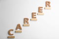 Stairs of wooden blocks and letters on background, top view. Career promotion concept Royalty Free Stock Photo