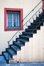 Stairway, Iron Railing And Red-Framed Window