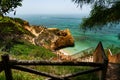 Stairway leading to a scenic beach at Albufeira surrounded by cliffs and greenery Royalty Free Stock Photo