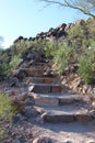 Stone steps of Signal Hill Trail lined with creosote bushes in Saguaro National Park, Arizona Royalty Free Stock Photo