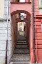 Stairway and steps in a narrow street of the Slovenian medieval city of Ptuj, with vintage old public lamps. Ptuj is the oldest Royalty Free Stock Photo