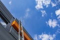 Stairway to Heaven. Metal staircase on the building against the background of the sky and clouds Royalty Free Stock Photo