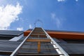 Stairway to Heaven. Metal staircase on the building against the background of the sky and clouds Royalty Free Stock Photo