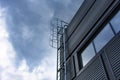 Stairway to Heaven. Metal staircase on the building against the background of the sky and clouds Royalty Free Stock Photo