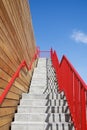 Stairway to heaven with red railing. Metaphors in Business and career growth Royalty Free Stock Photo