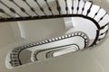 Stairwell from Below: White Oval Shape of Stairs in a Multi-storey Building Royalty Free Stock Photo