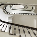 Stairwell from Below: White Oval Shape of Stairs in a Multi-storey Building Royalty Free Stock Photo