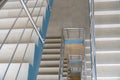 Stairwell in a modern building. Staircases as an emergency evacuation exit from the building in case of fire or emergency. Clean Royalty Free Stock Photo